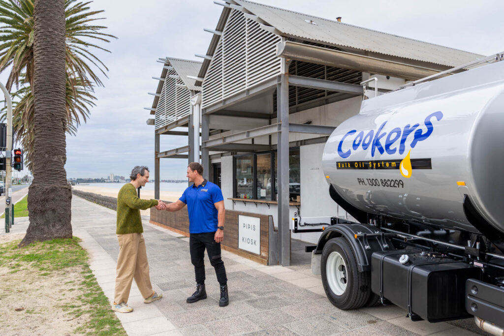 Cookers truck drive next to truck with restaurant owner