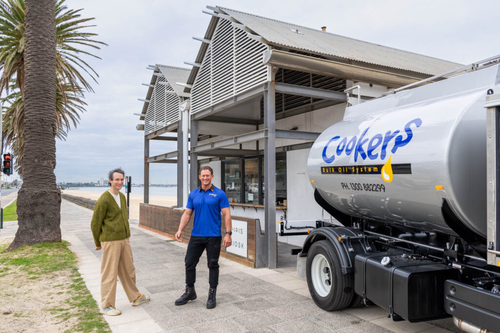 Cookers truck drive next to truck with restaurant owner