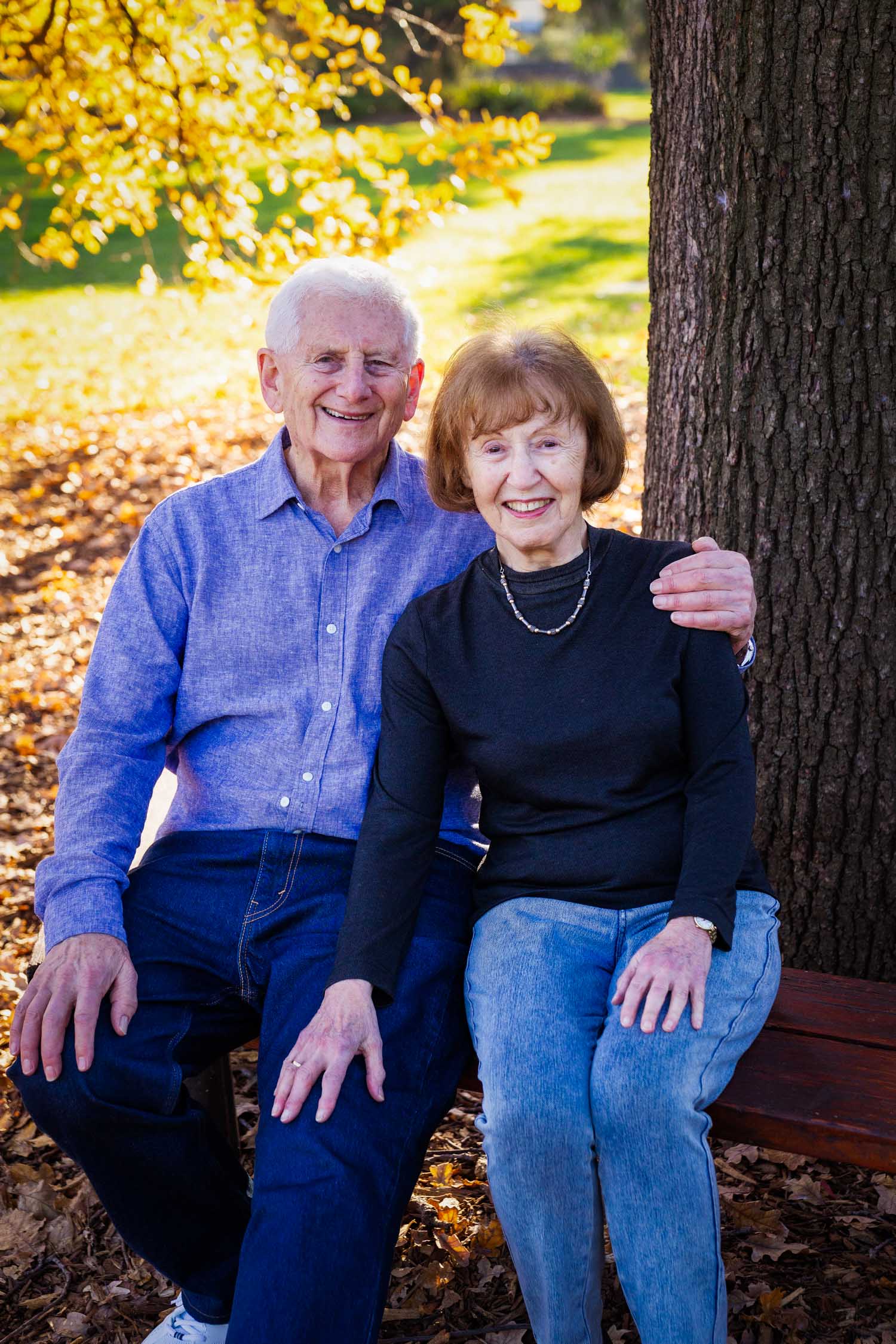Family in garden under tree golden light