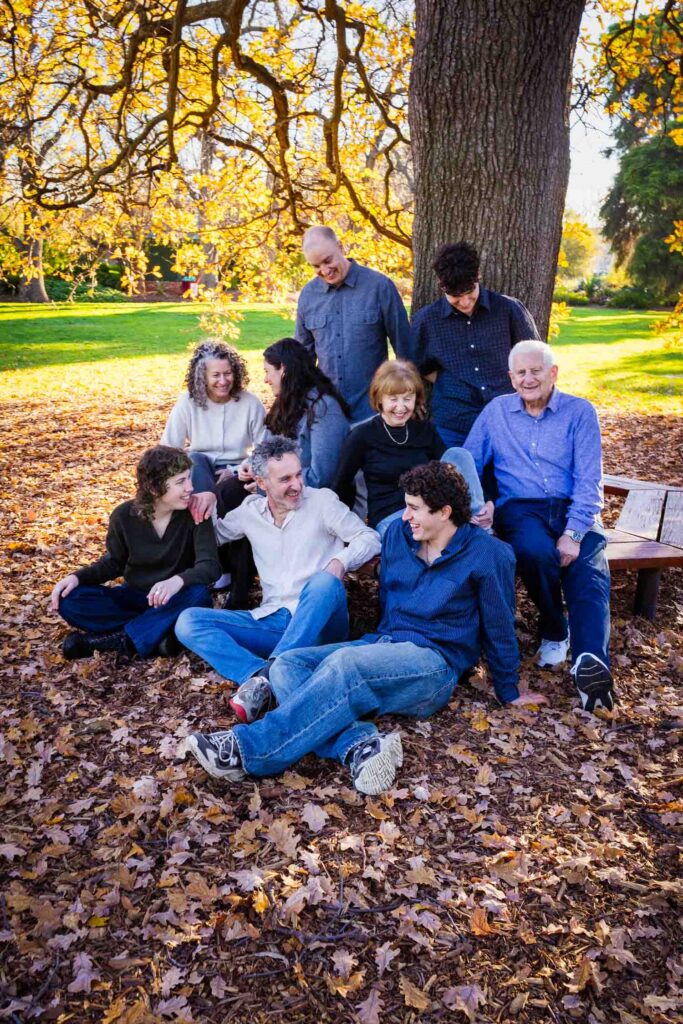 Family in garden under tree golden light
