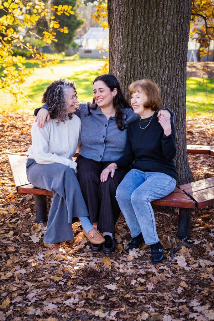 Family in garden under tree golden light